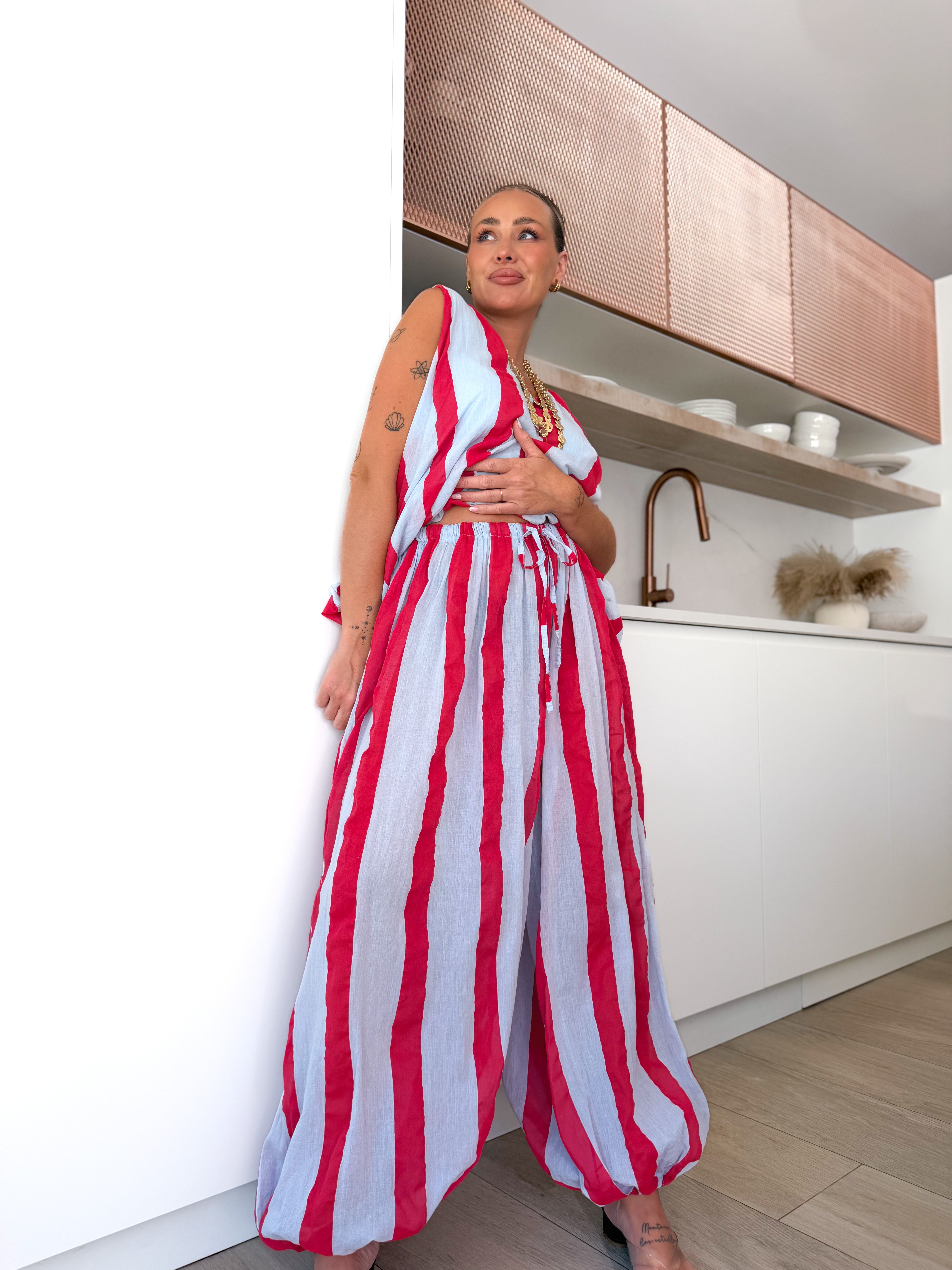 Pantalón rayas celeste / fucsia