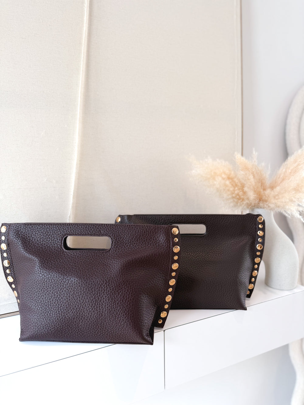 Bolso polipiel tachas