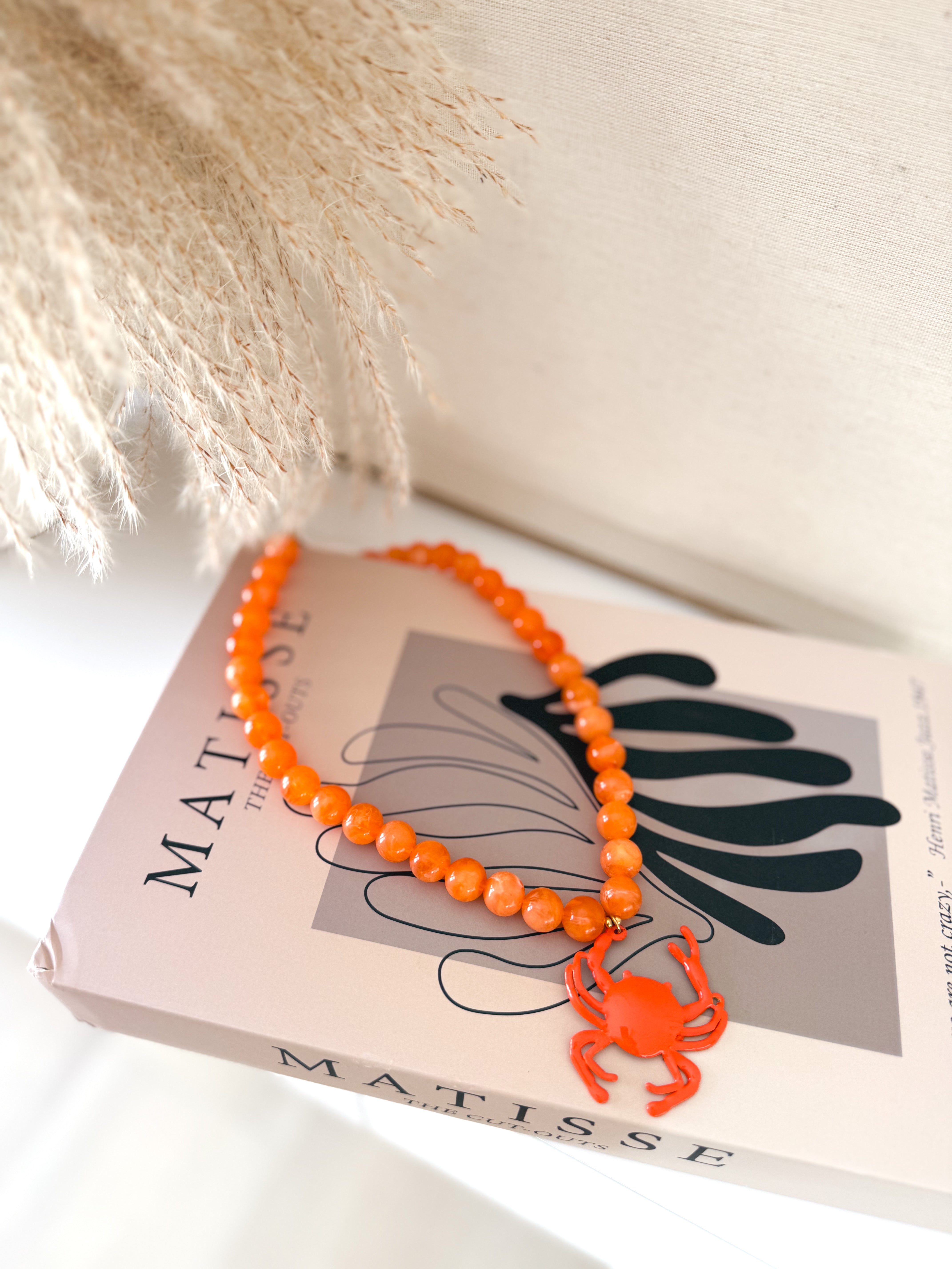 Collar cangrejo naranja
