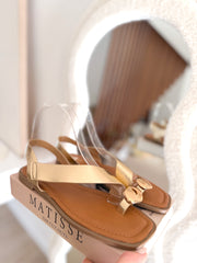 Sandalias planas Cruzadas oro