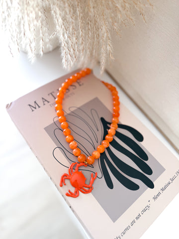 Collar cangrejo naranja
