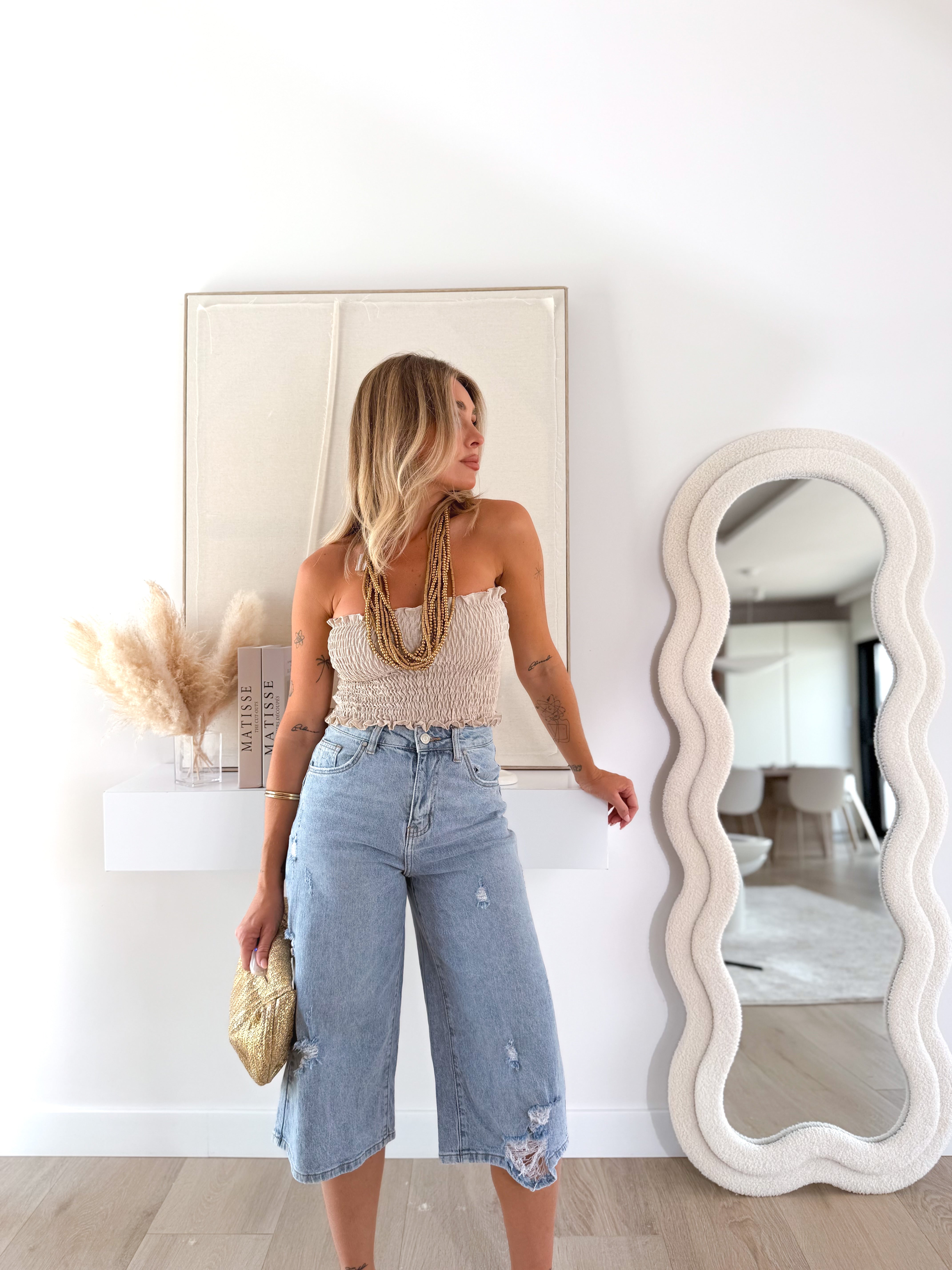 Bermuda denim desgastada