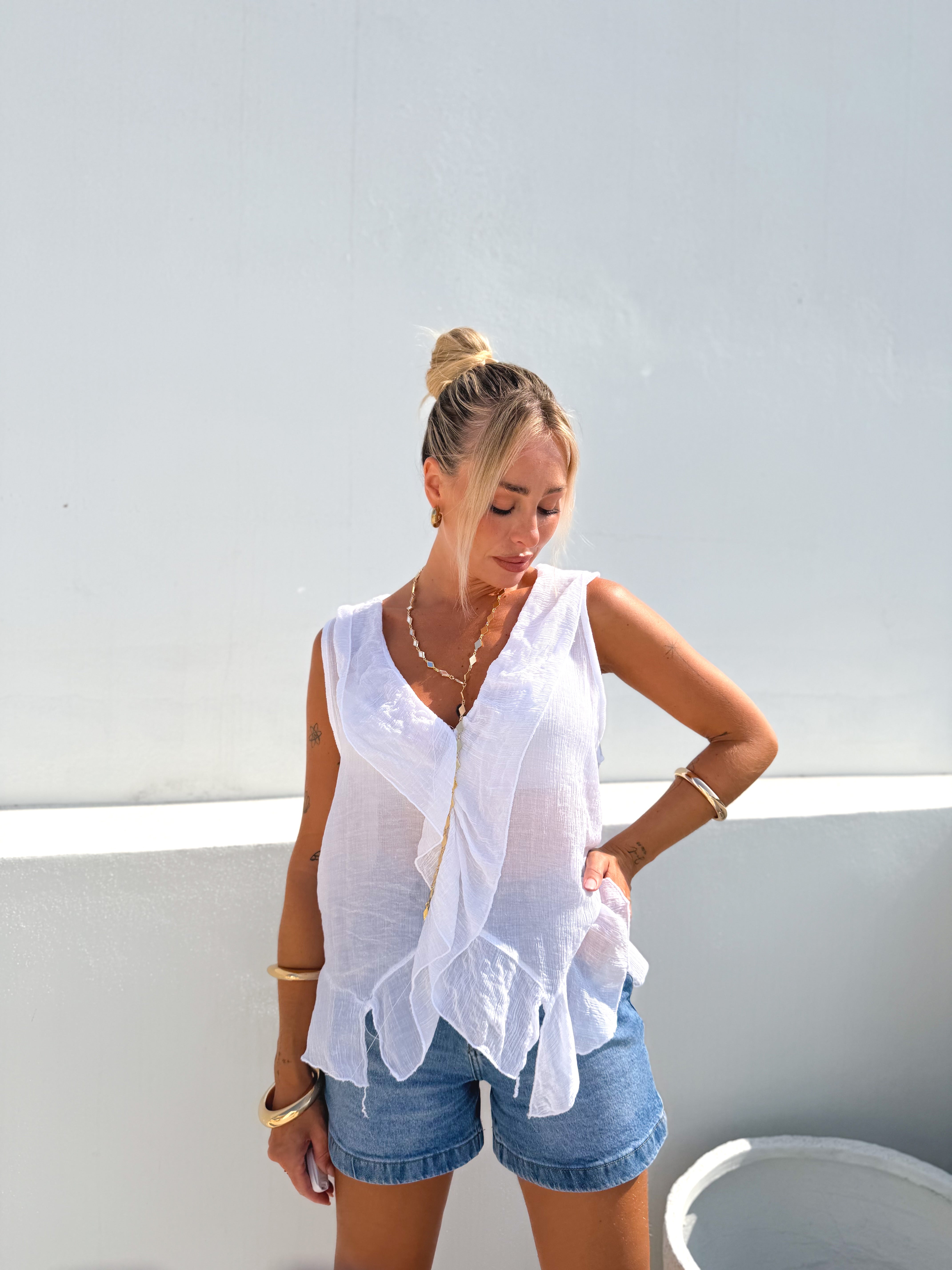 Camisa sin mangas volantes blanca