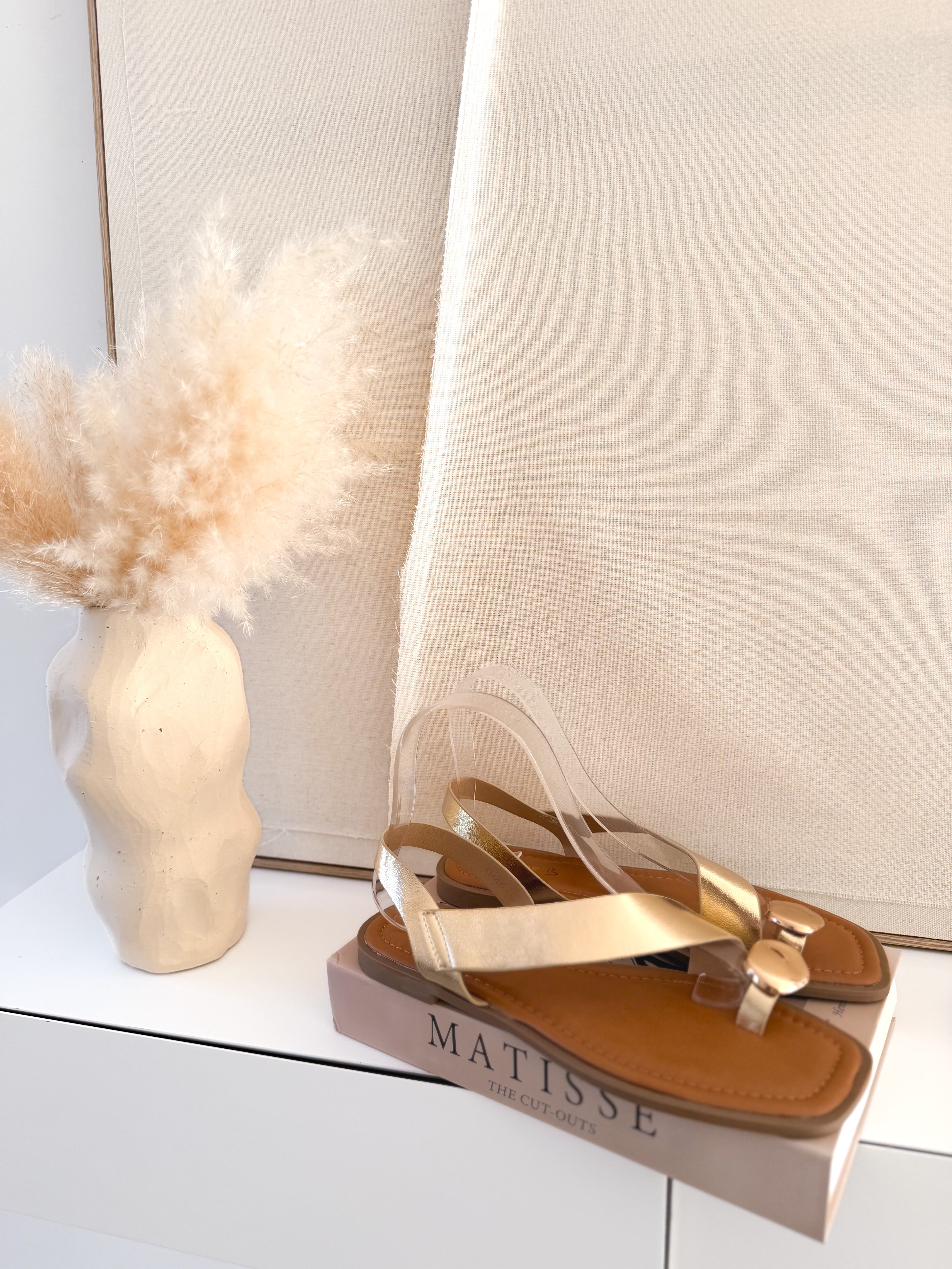 Sandalias planas Cruzadas oro